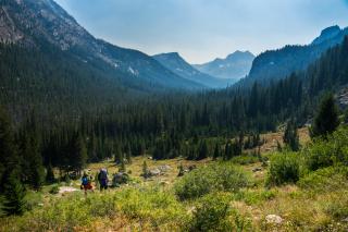 A couple of backpackers stop to take in the view on their way to Alpine Lake in Redfish Lake Canyon in the Sawtooth National Forest. 