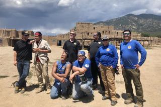 Group photo: Rocky Mountain Youth Corps director, participants, in Taos Pueblo.