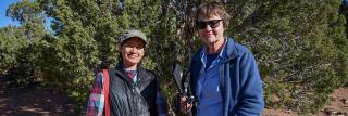 A pair of scientists pose for a portrait.