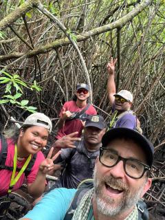 Selfie: Rich MacKenzie and team in mangrove forest.