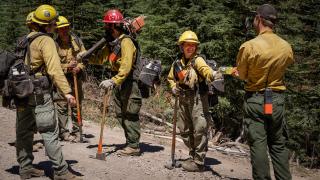 Group of Forestry Technicians standing on a trail