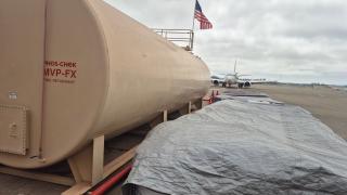 Fire retardant pit at Santa Maria air tanker base, California. Air tanker is in background.