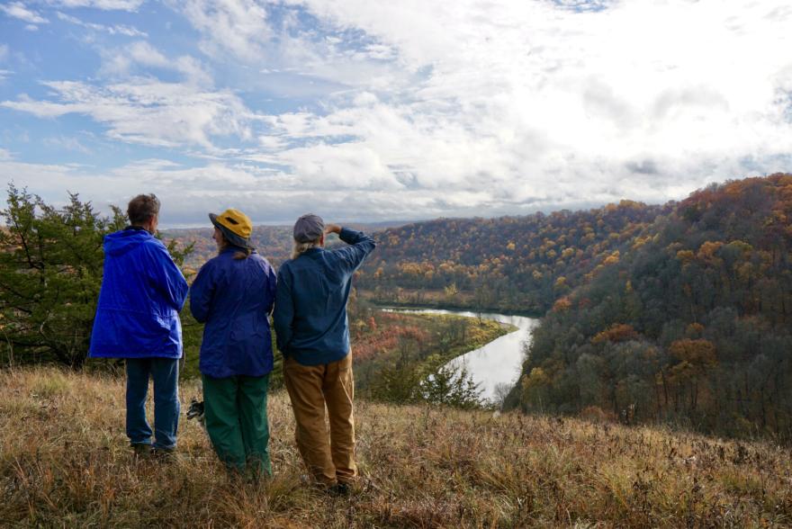 Three individuals stop to enjoy the late autumn view overlooking the Upper Iowa River on the project tract.