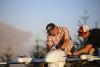A picture of two people working on a large wildland firefighting request.
