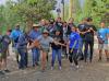 Wildlife biologist and education coordinator Ashley Mueller celebrates with the 2022 Native American Fish and Wildlife Society National Summer Youth Practicum completion of the Colorado State University ropes course.