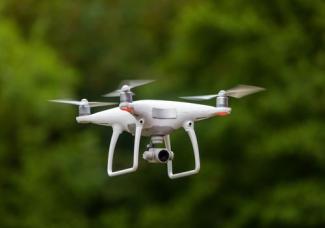 white-drone-with-camera-propellers