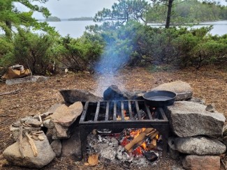 a fire grate surrounded by rocks in the Boundary Waters Canoe Area Wilderness