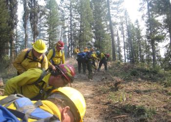 A fire crew digs line