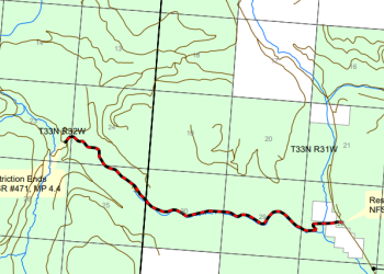 Screenshot of a map with section lines, ownership, and roads showing a red highlighted road segment