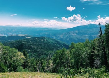 View of mountains and greenery from a high elevation.