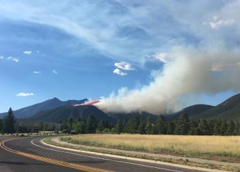 A tanker aircraft drops retardant on the Museum Fire above Flagstaff on July 21, 2019.