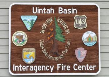 A large sign depicting numerous agencies associated with the Uinta Interagency Fire Center.