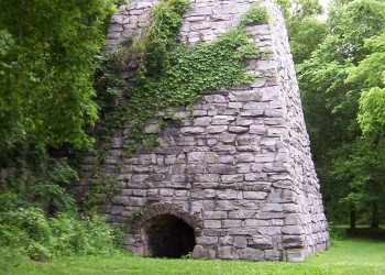 A stone structure with a kiln at the base.