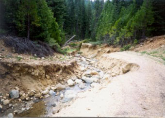 Photo of a washed out road.