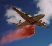 Photo of multi-engine airtanker dropping fire retardant