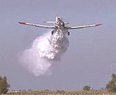 Photo of a single engine airtanker dropping suppressant