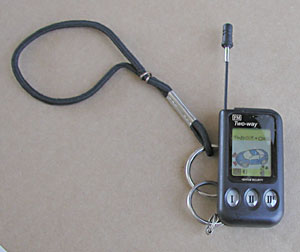 The handheld transmitter has a concealed antenna that can be extended to improve signal range.  This tiny device measures 1" wide x 1-1/2" attaches to a key chain or lanyard to help prevent it from being lost.
