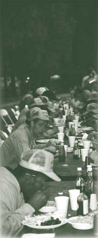 Photograph of firefighters eating.