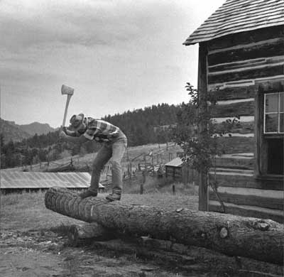 Photo of a man scoring a log.