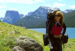 Charmaine on a hike of the Highline Trail, Green River Lakes and Squaretop Mountain in the background.